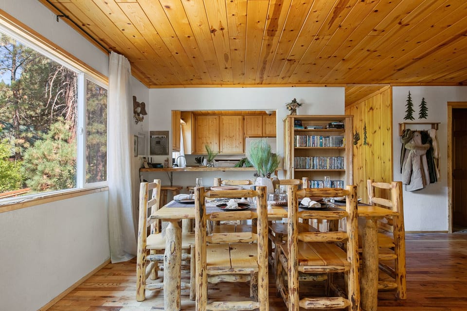 Dining area with 6 person table and 4 person breakfast bar