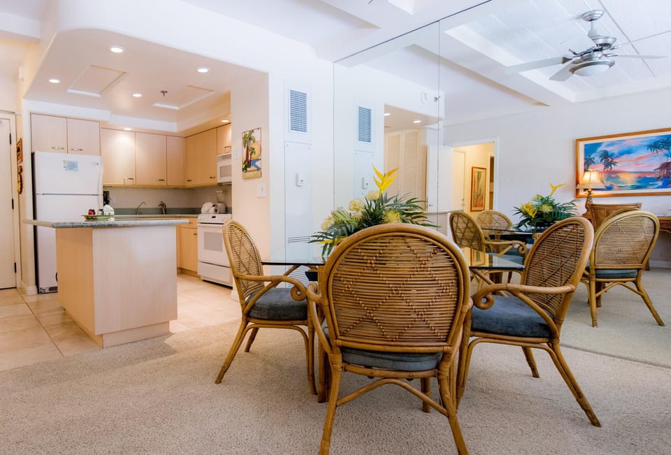 Open kitchen with granite island and dining area