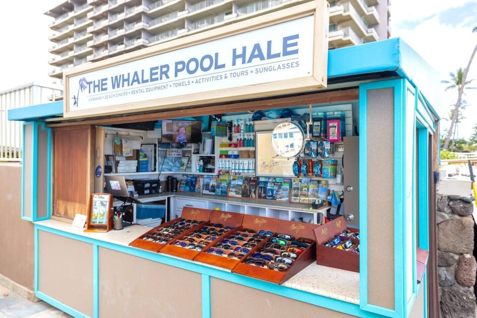 Pool cabana with sunglasses for purchase and daily towel service