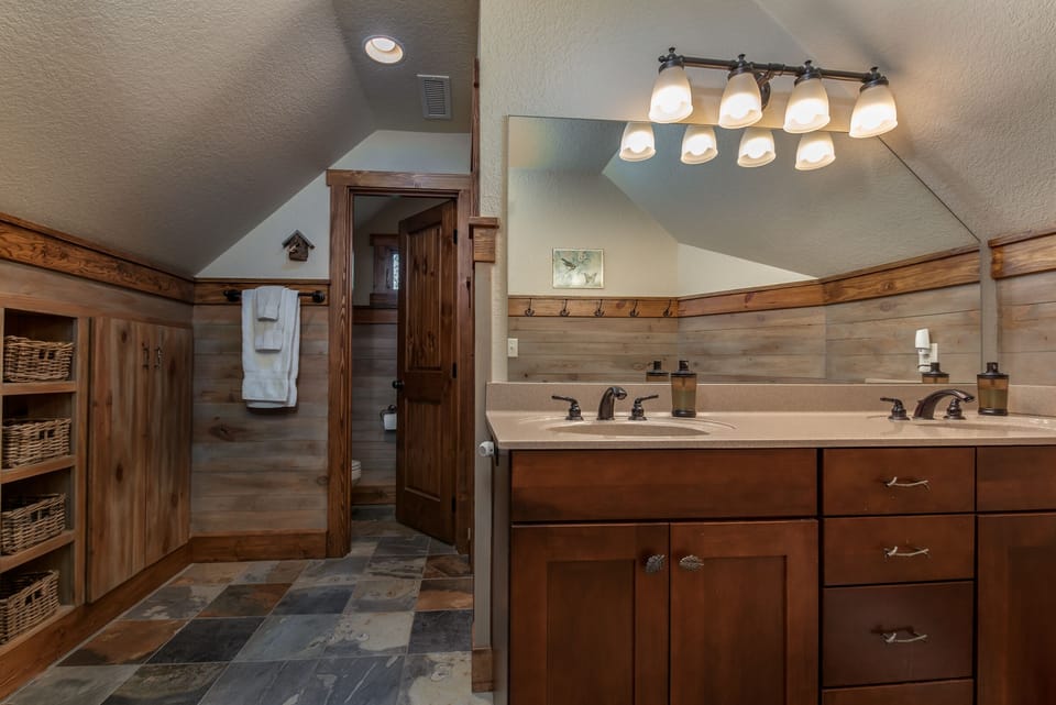 2 Loft Bedrooms share this Locker Style Bath with private potty room & shower