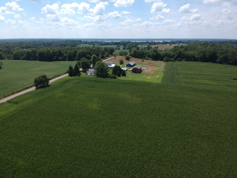 View from above of our property with Lake Maxinkuckee in the distance. 