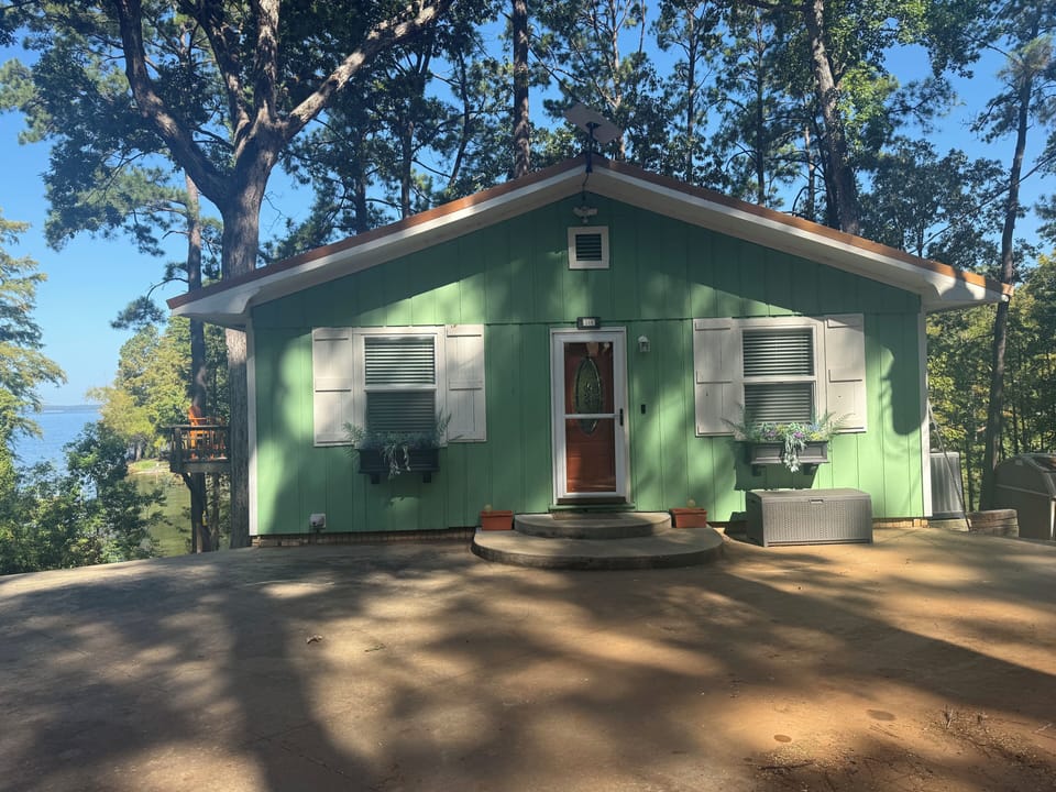 The cutest green house on the most beautiful cove!