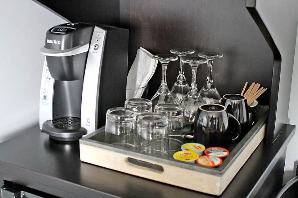 Kitchenette with Refrigerator, Keurig Coffee Maker, K-cups, and Microwave