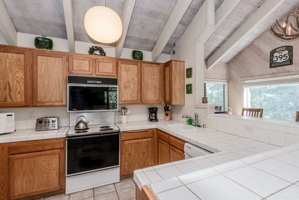Kitchen with counter seating two sides