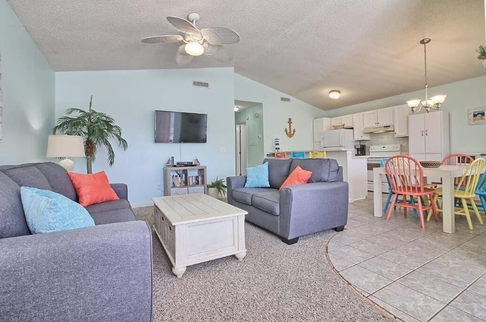 Living room with flat screen Smart TV and a selection of books and movies