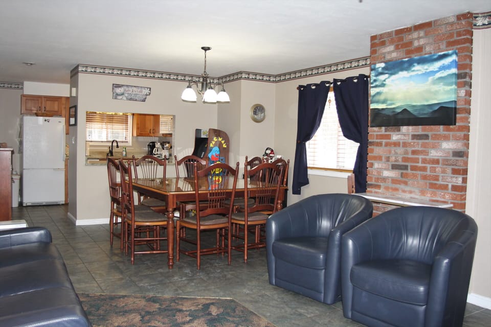 Dining area square table for 8.
2 seats at bar and additional chairs
in closet 