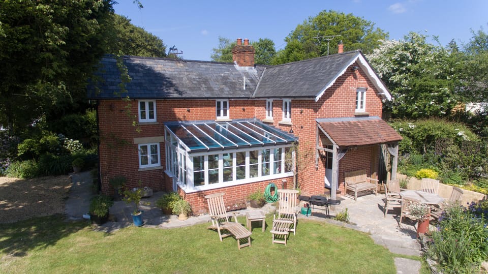 Detached  cottage with south facing garden and conservatory.