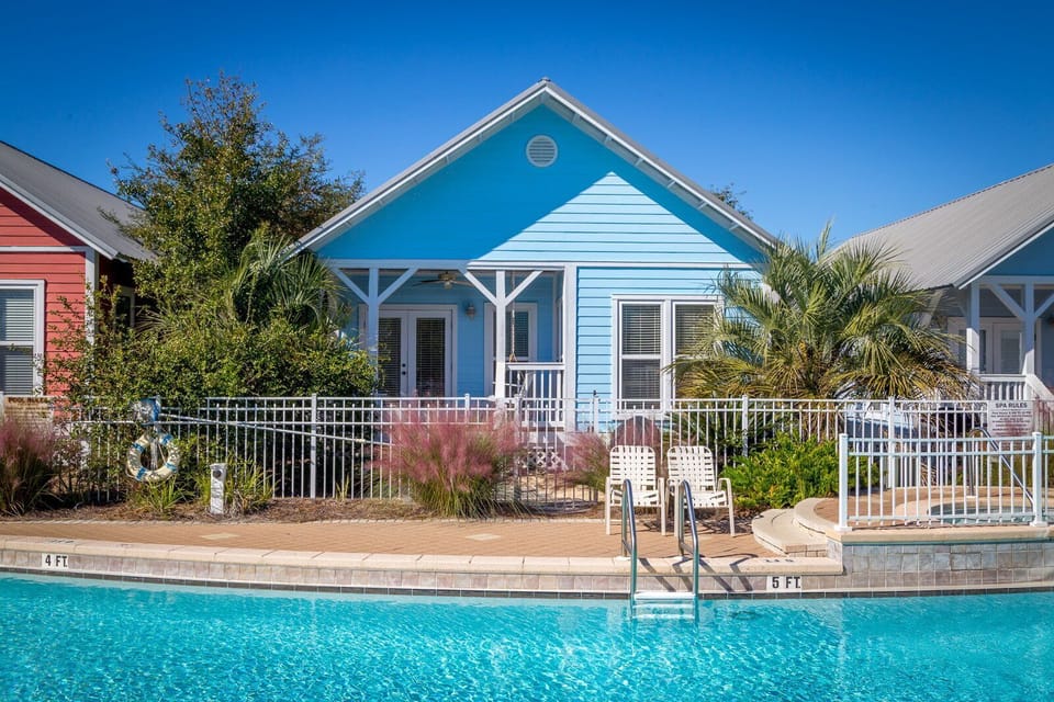 Back porch is right off the pool for a quick dip after a long day at the Beach!