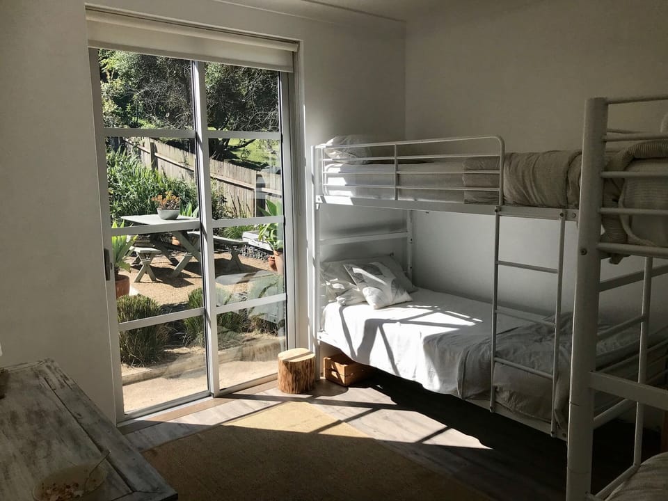 Back kids bunk room with early morning 'escape doors'  to access garden