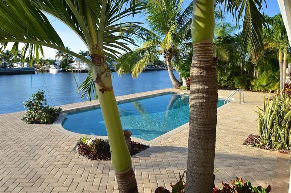 Spectacular Outdoor Pool & Lounge Area Offering Picturesque Waterway Views......