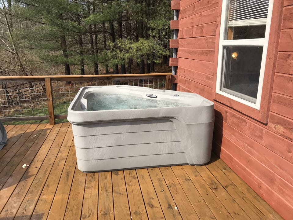 Hot Tub on back porch overlooking pond