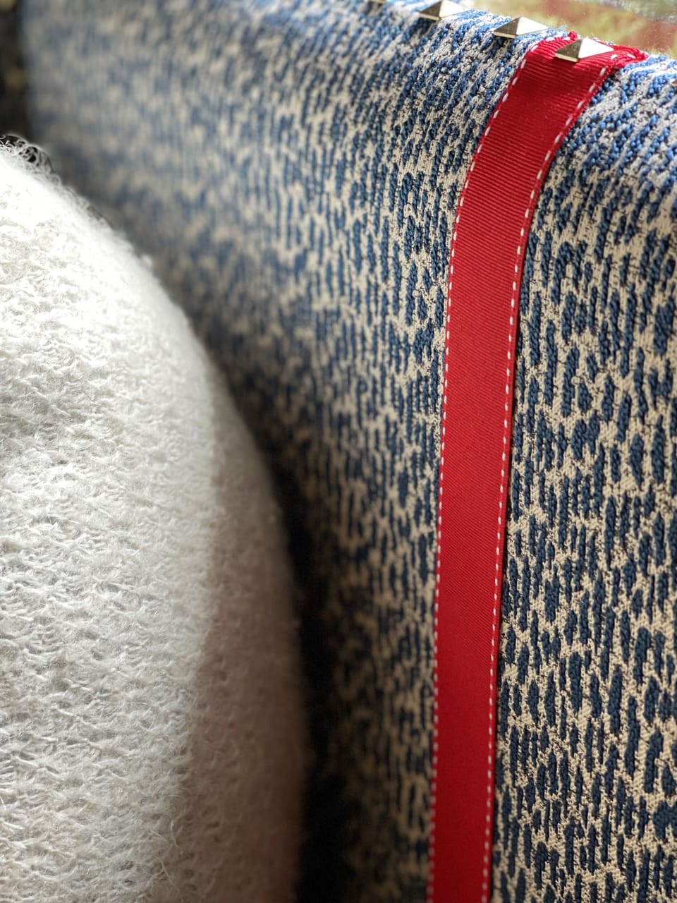 Upholstered headboard with fine details. 