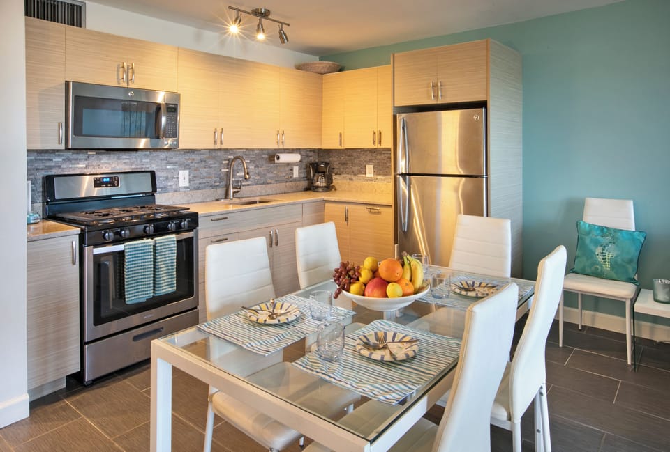 Kitchen is fully stocked for cooking and dining