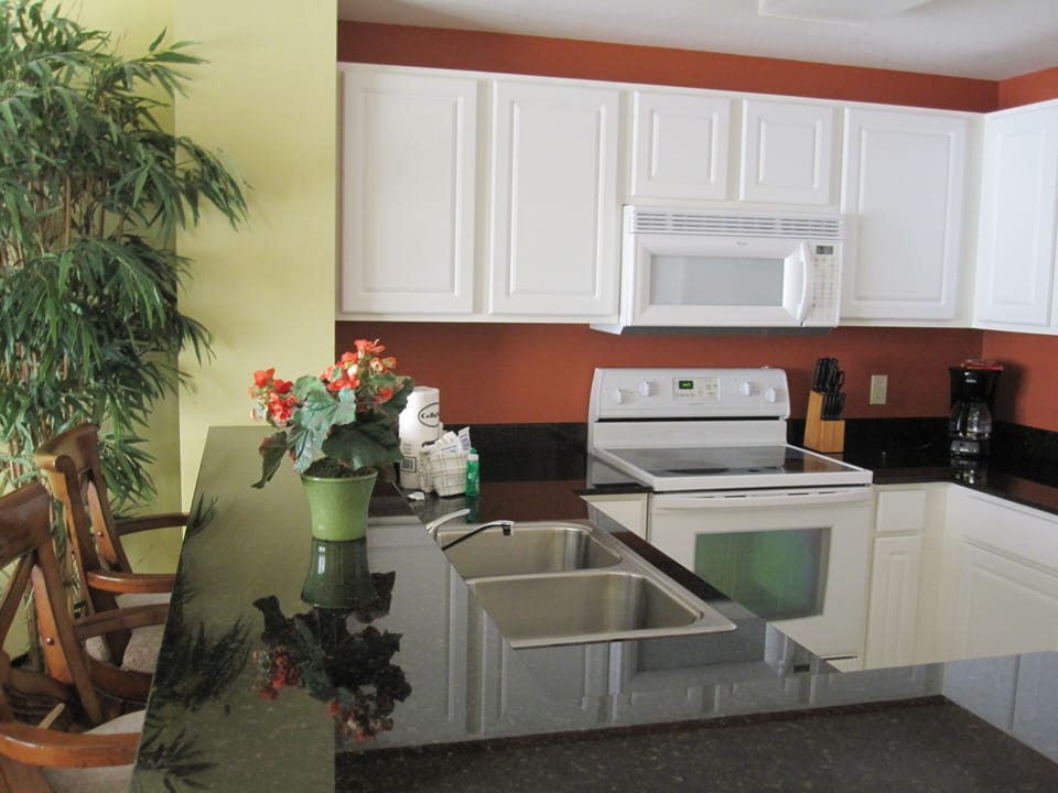 Kitchen with full cooking and dish sets