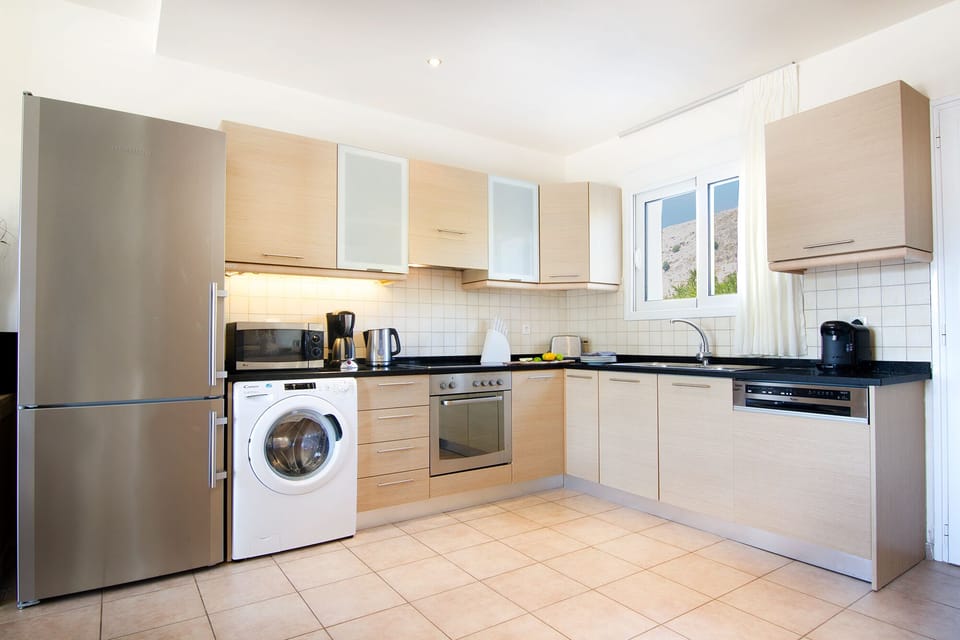 Vast kitchen with an array of equipment, including full size dishwasher