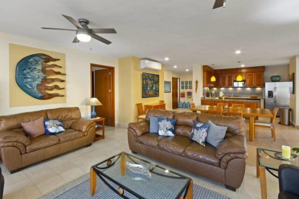 Living room, dinning room and kitchen with ocean view