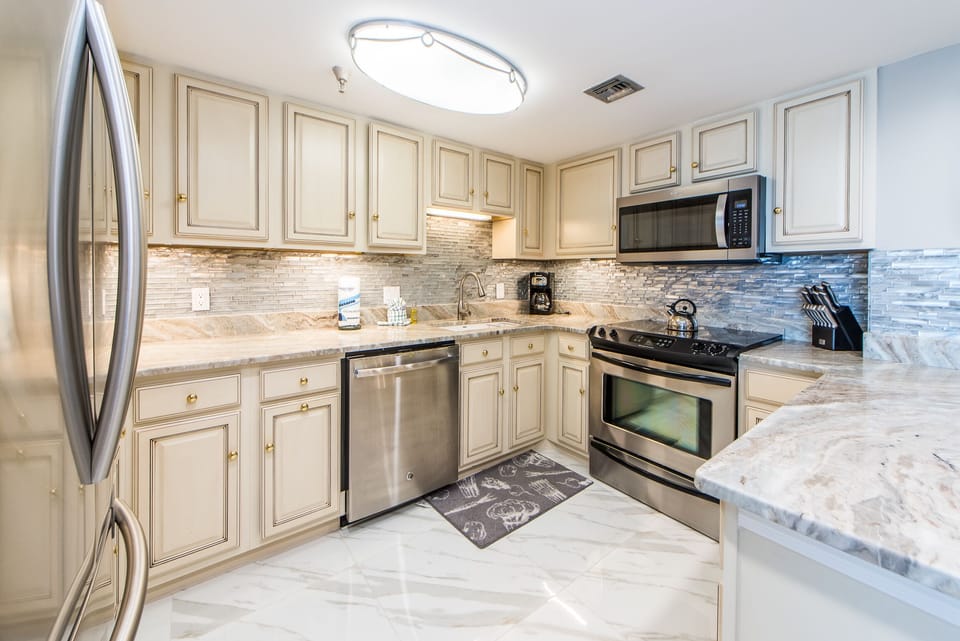 Open Kitchen w/Tile Backsplash and Stainless