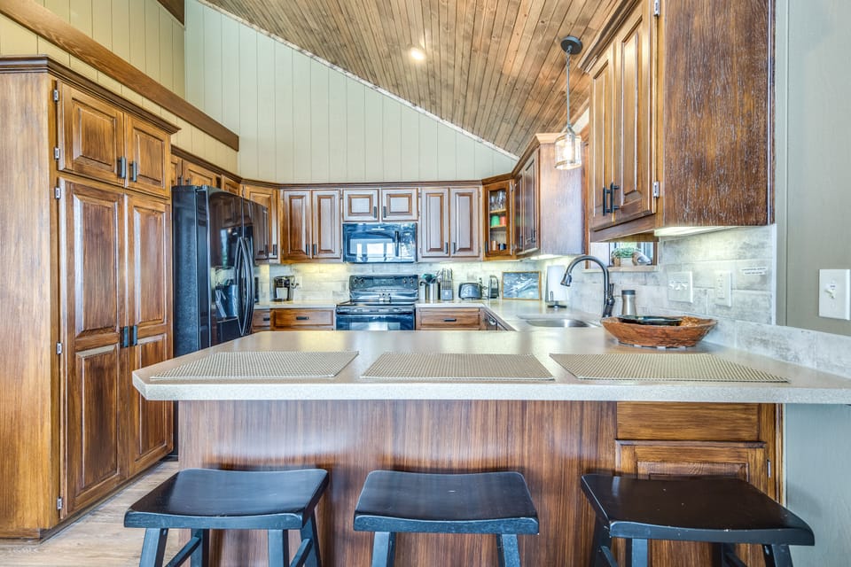 Counter seating for 3 people - there is also a small table and chairs nearby.