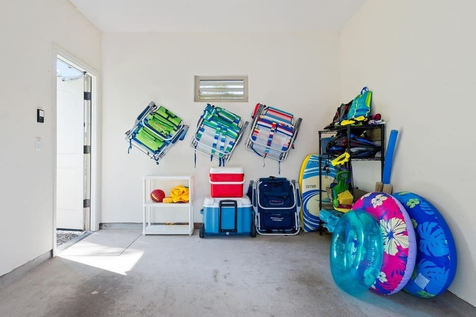 Beach gear included: umbrella, chairs, boogie boards, snorkel sets, cooler, sand toys