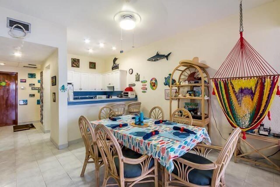 The dining room table comfortably seats six and is a great place to enjoy a meal prepared in the adjacent gourmet kitchen