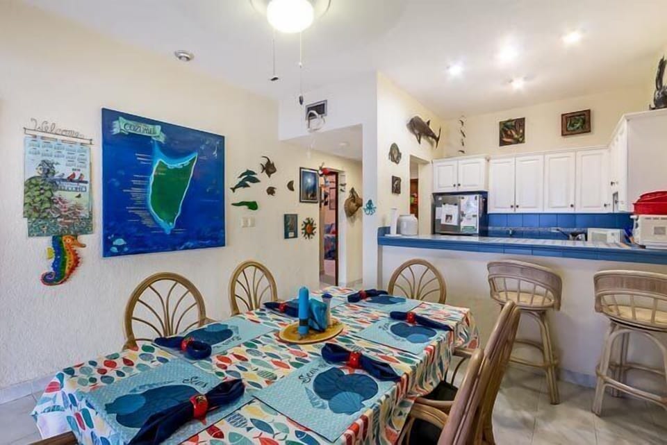 The dining room table comfortably seats six and is a great place to enjoy a meal prepared in the adjacent gourmet kitchen
