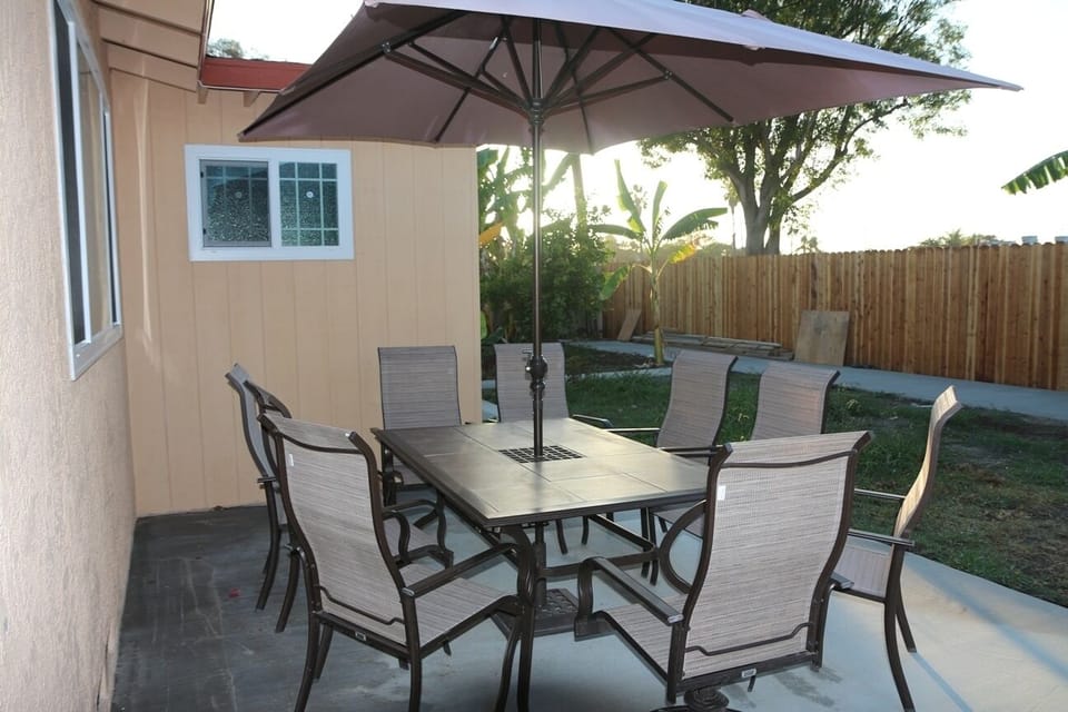 Patio with table, chairs and umbrella