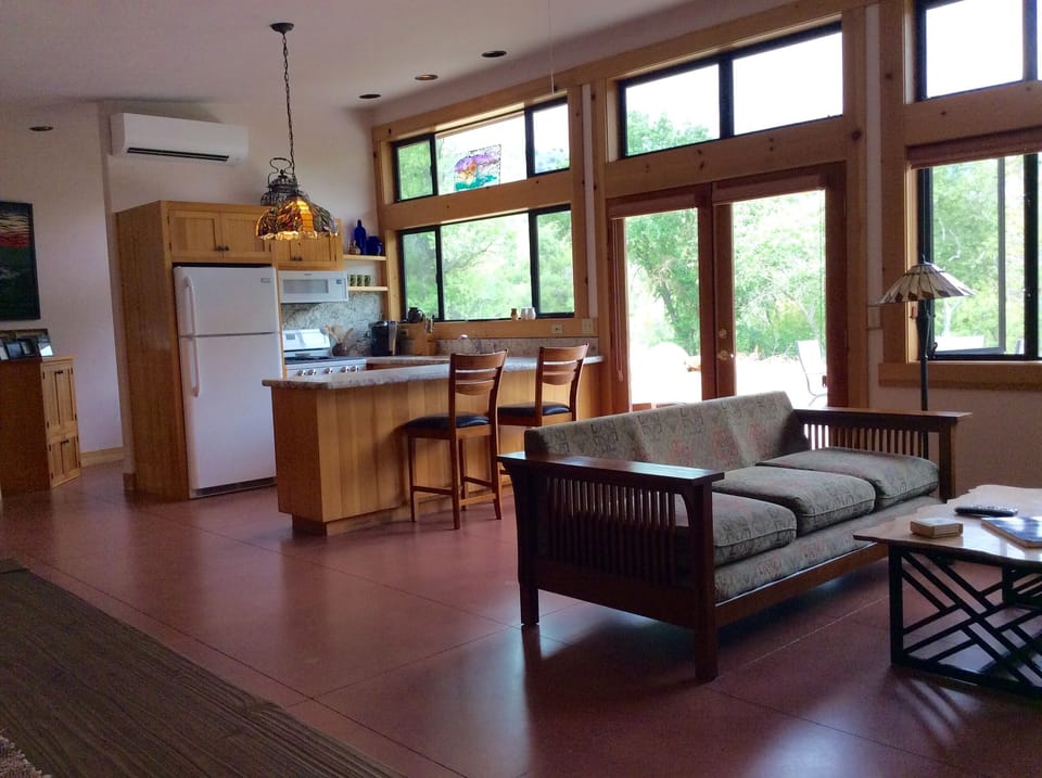 The house's open floor plan creates a comfortable flow & cozy environment