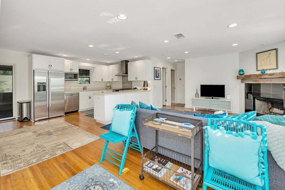 Open living room and kitchen with upscale appliances