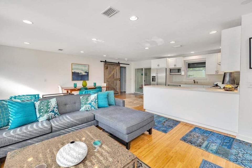Open living room and kitchen with sectional sofa