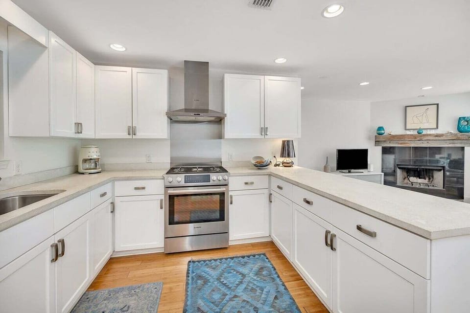 Kitchen with white cabinets and wooden floors