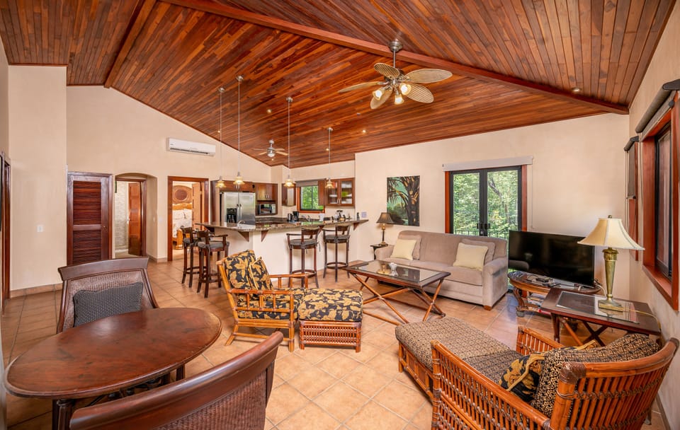 view from great room to kitchen - high teak ceilings