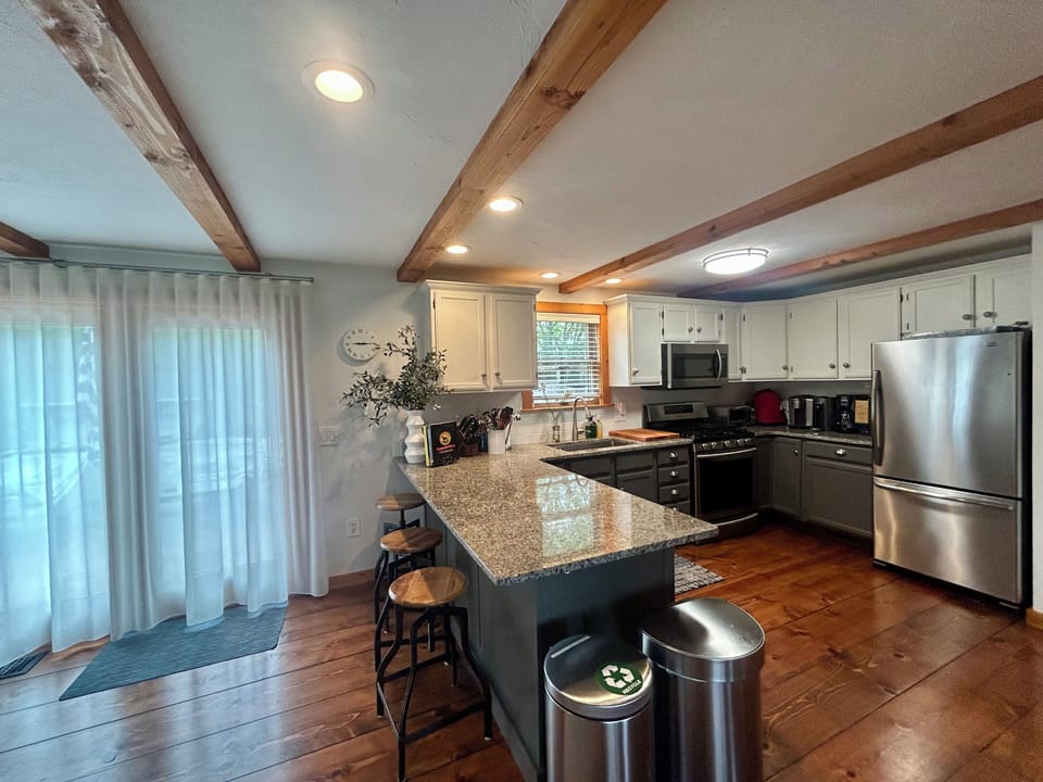 Kitchen with counter seating. 