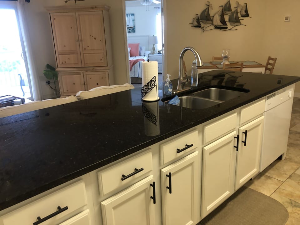 Open concept living and kitchen area with granite counters.  