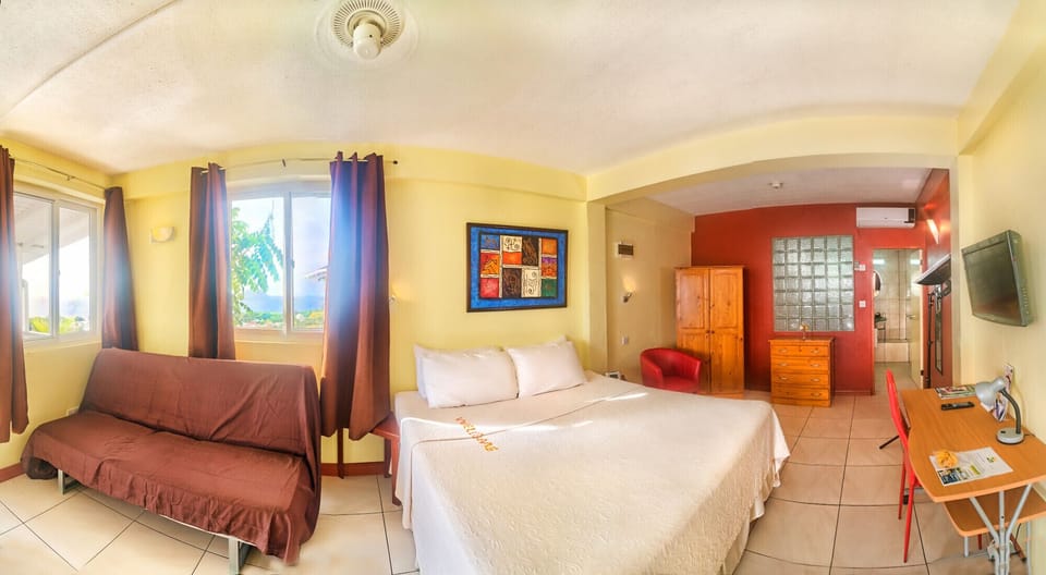 Superior Room 3 with a king bed and a sofa bed and the best view of Cabrits 