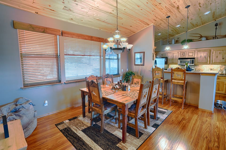 Kitchen table easily seats six, bar seats two, bench & stool for addtl seats