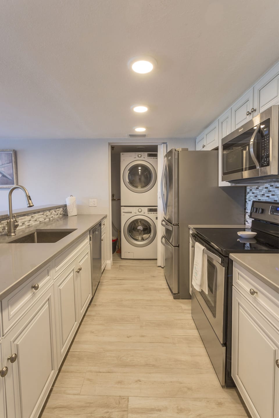 Stainless steel appliances in a fully stocked kitchen 