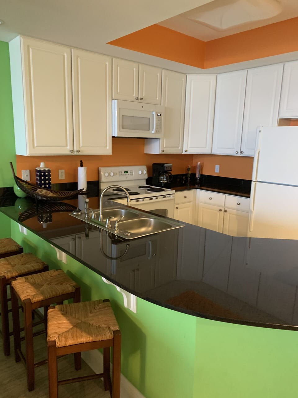 Kitchen with microwave, oven, stove, dishwasher, refrigerator with ice maker.