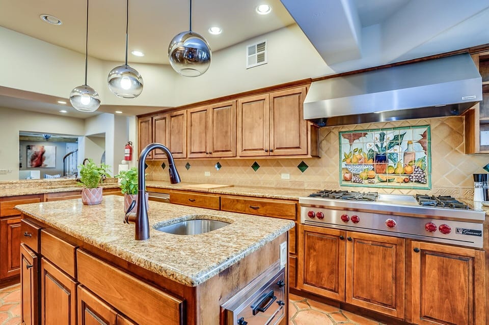 A 36' fridge and freezer combo, a multi-burner gas stove, and a convenient pullout toaster drawer make the kitchen a vintage aficionado's delight.