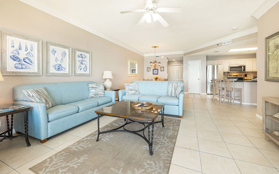 Relax on plush seating while enjoying lively conversation and warmth from the stunning coastal decor