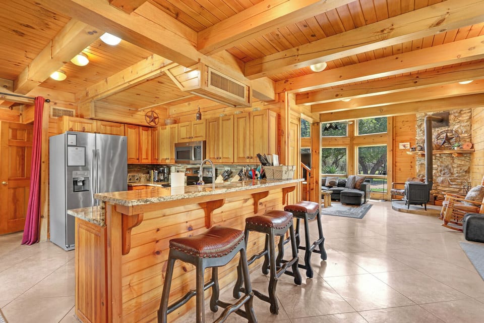 The bar looking into the full kitchen is a natural gathering place
