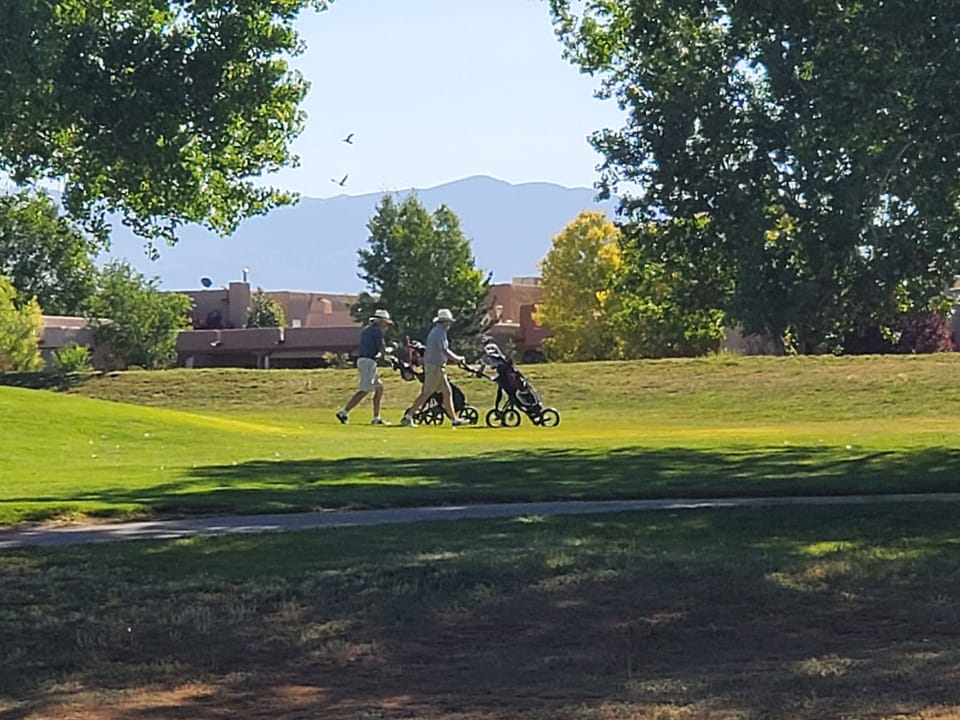 Sangre de Cristo Mts. and golfer view from relaxing patio living