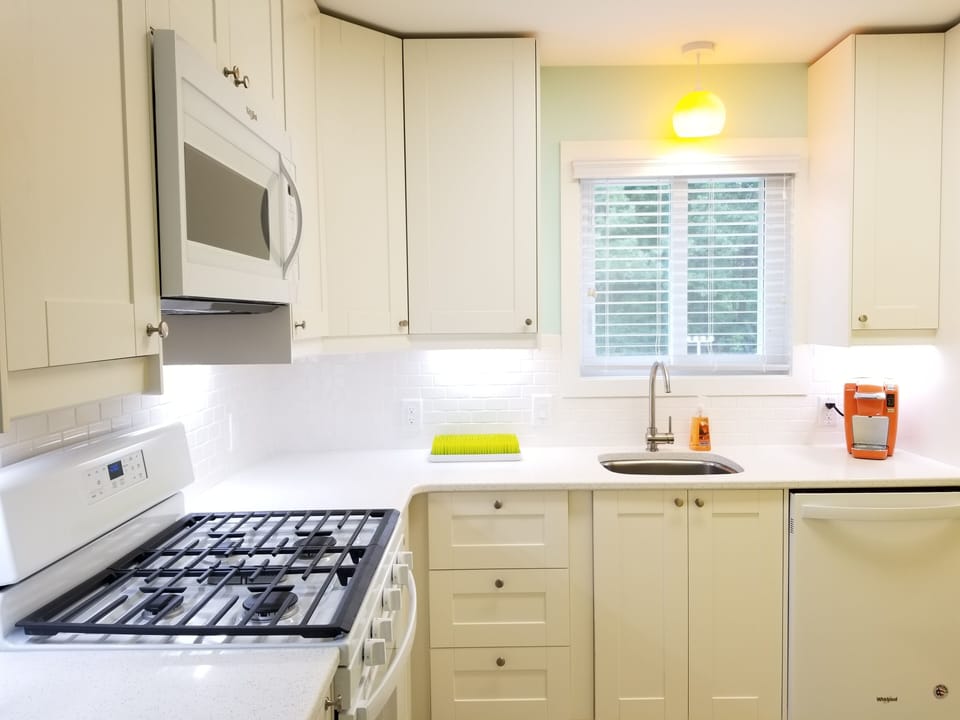 Bright and cheerful clean kitchen. Everything you need. Book today.