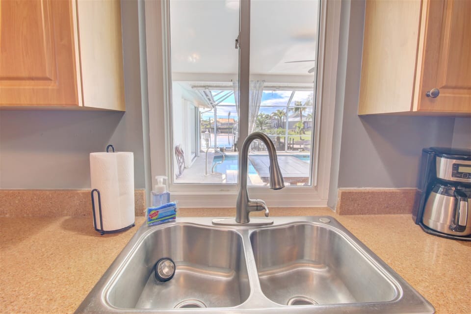 Slide window to get things out to the pool area from kitchen.