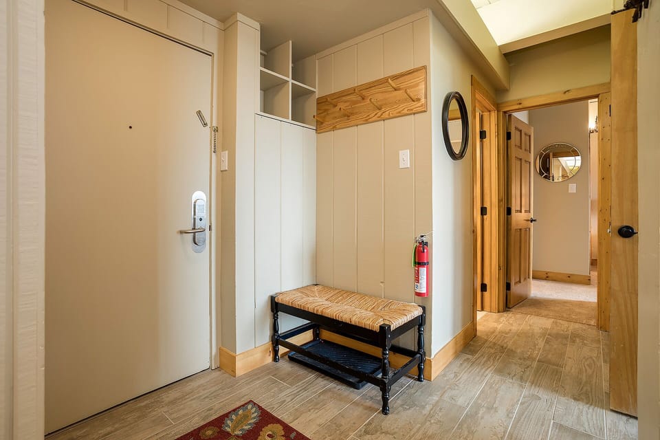 Step into your welcoming entryway with custom built-in storage and rustic bench—perfect for organizing gear after mountain adventures.