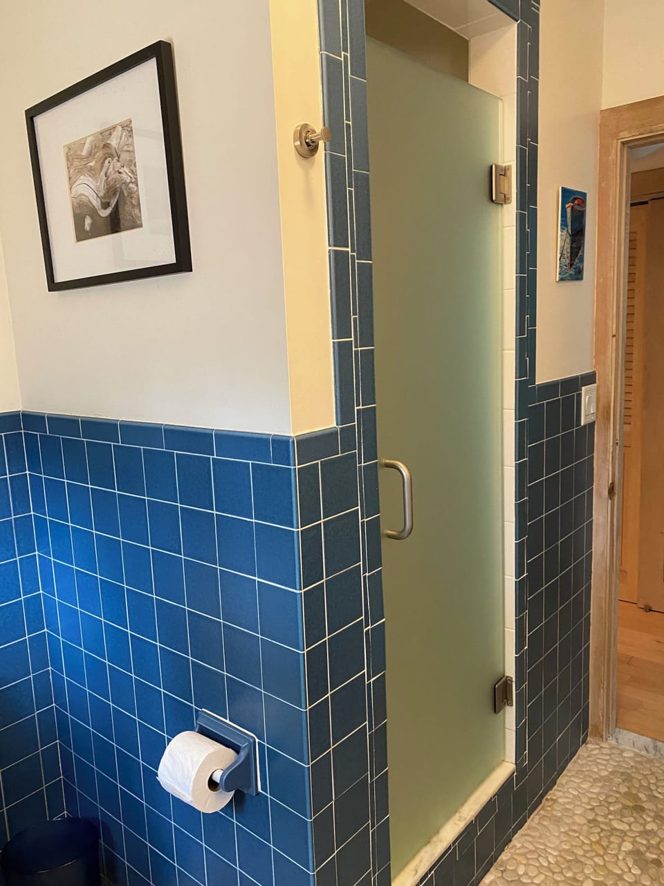 Main floor bathroom with glass enclosed shower 