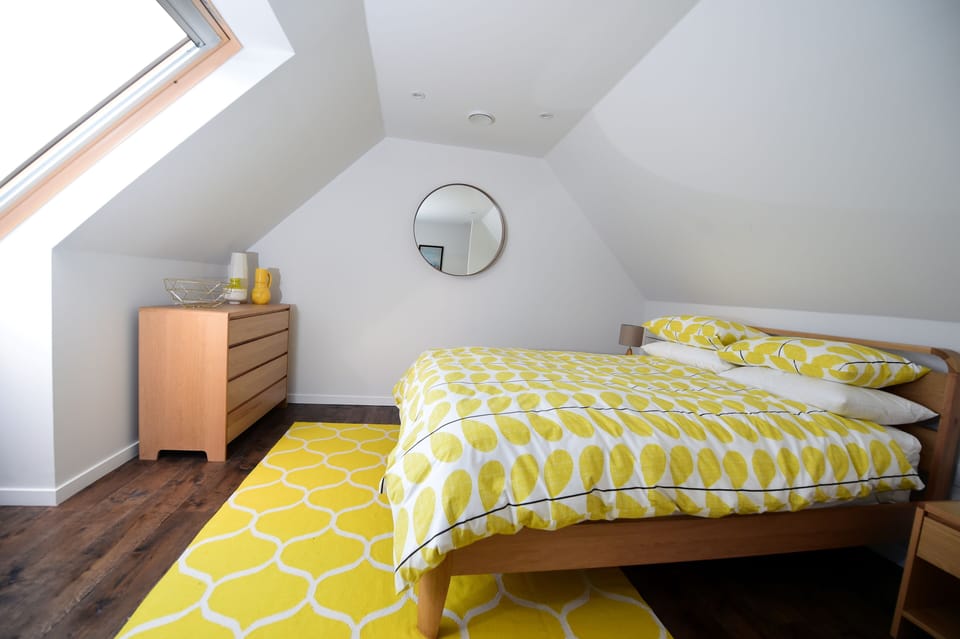 Mezzanine style bedroom with king size bed.