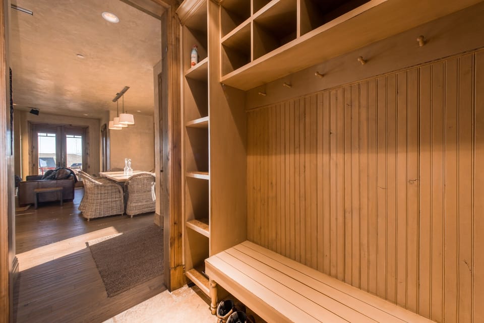 Mud room with closet space for jacket storage, ski gear, and more. 
