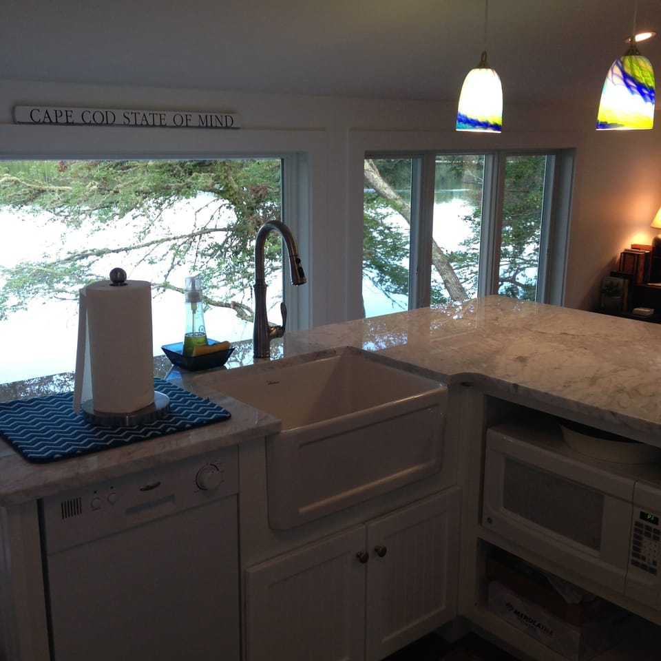 Farmhouse kitchen sink with amazing 'ships prow' waterview.