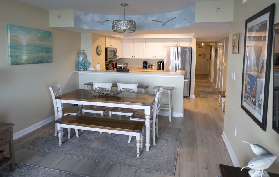Dining area with custom made farmhouse table, seats 8 w/additional bench