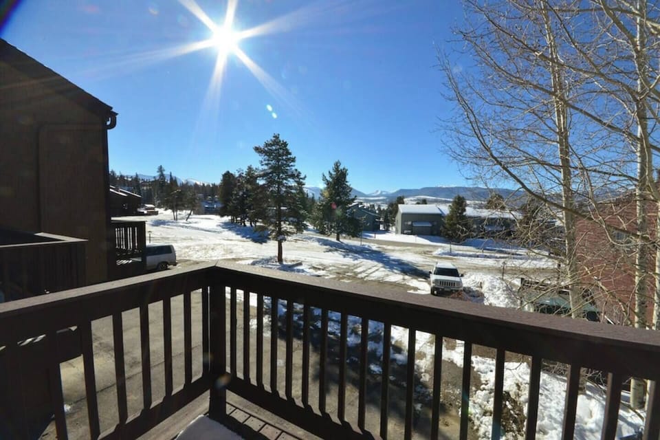 View from the deck; nice gas grill and chairs not shown. MeadowRidge Resort Clubhouse is a half block straight ahead. Ski area is short free bus ride. Bus stop at end of my drive (shown)